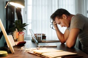 man-stressed-at-desk
