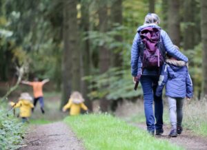 family-walking-in-the-woods