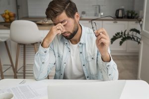 fatigued-adult-male-working-from-home