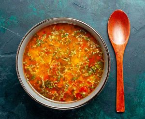 top-view-delicious-tomato-lentil-vegetable-soup-inside-plate-green-background-food-vegetables-ingredients-soup-product-meal
